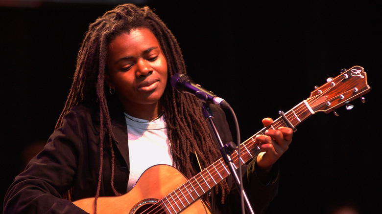 Young Tracy Chapman playing guitar 