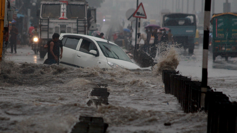 flooded street with people and cars