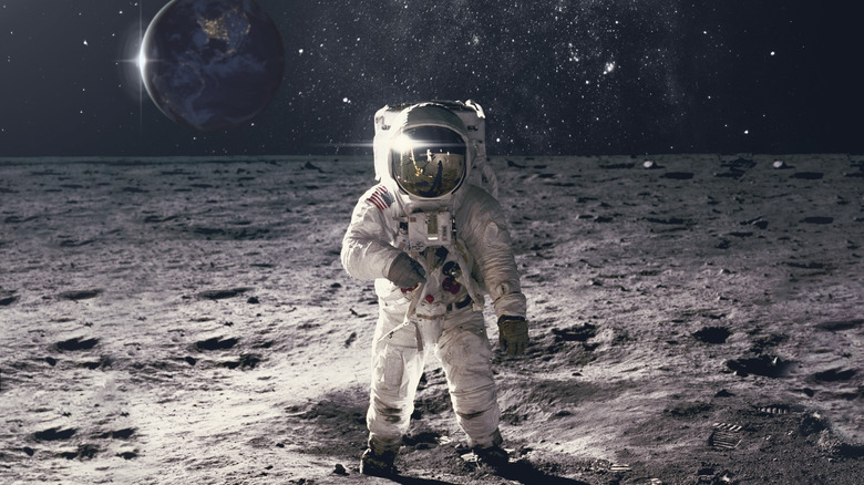 Astronaut surrounded by lunar dust