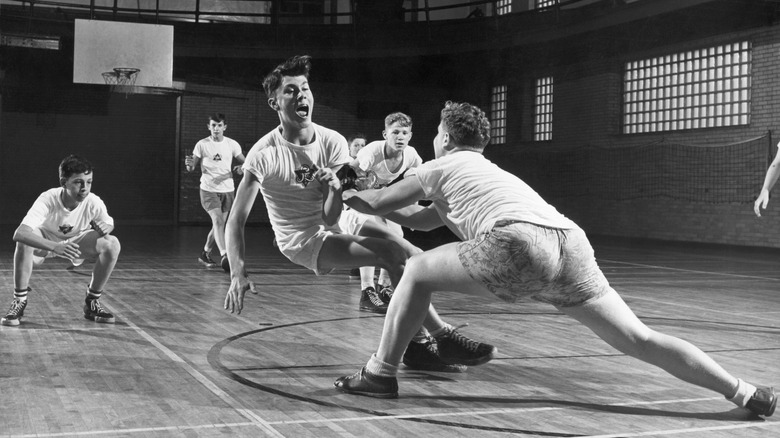 early basketball game at the YMCA players falling over