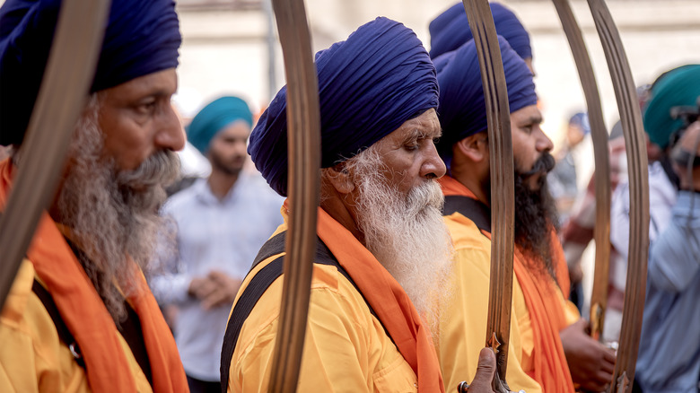 Sikh men carrying swords at Vaisakhi