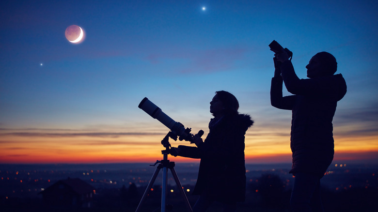 people looking at lunar eclipse