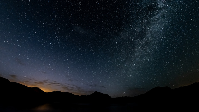 Milky Way stretches over mountains