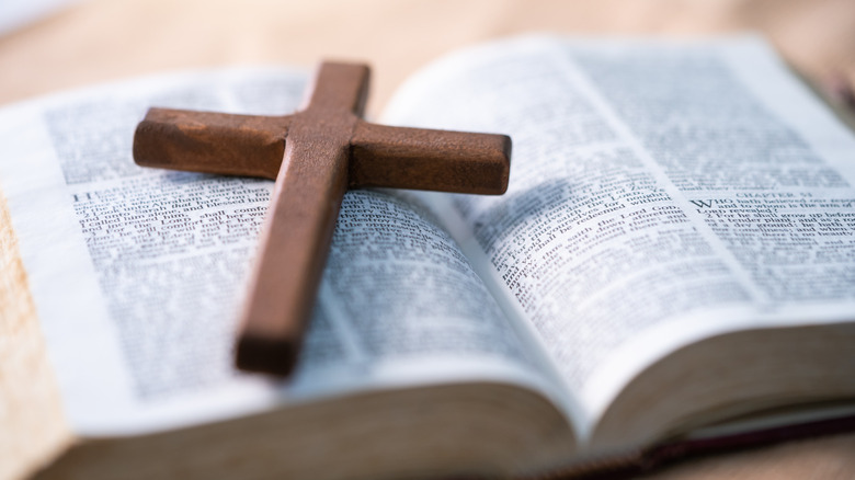 Small cross placed on Bible