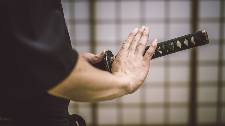 Swordsman with hand on hilt