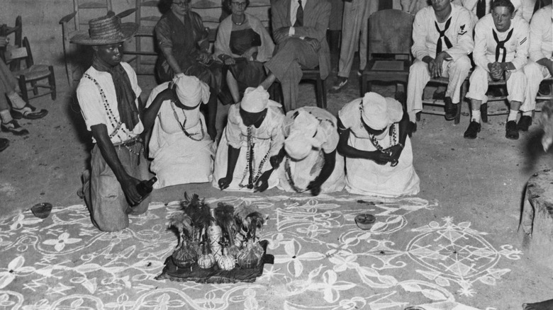 Haitian vodou ceremony with sailors watching