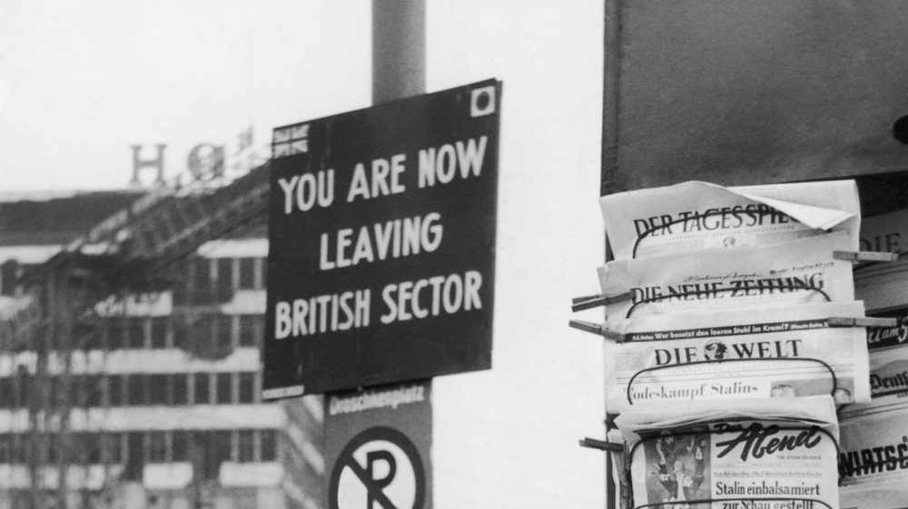 A sign reading "you are now leaving the British sector" in postwar Berlin