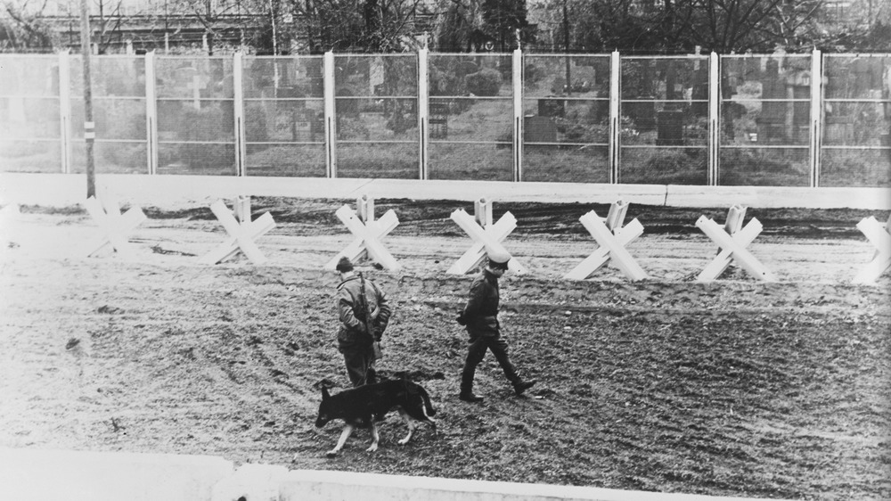 Berlin Wall guards and guard dog