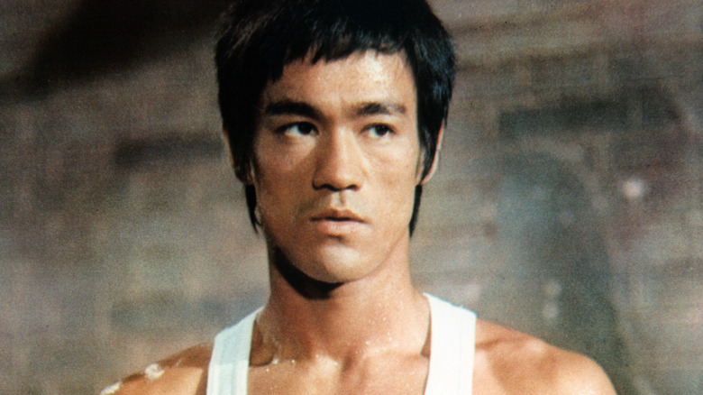 bruce lee in white tank 