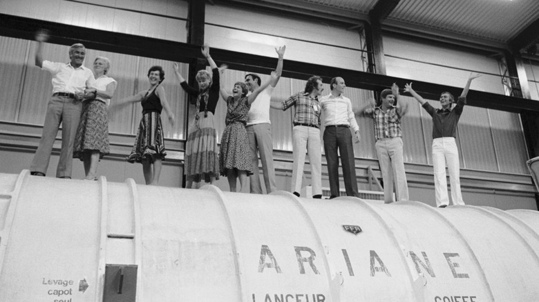 people celebrating on ariane rocket