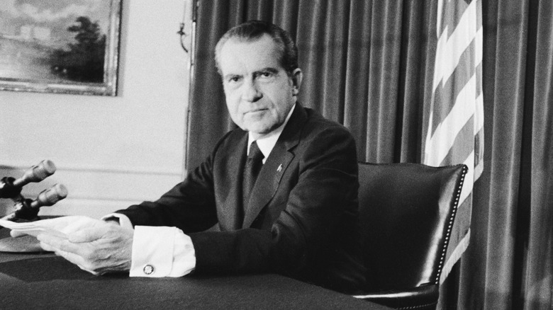 nixon sitting at desk