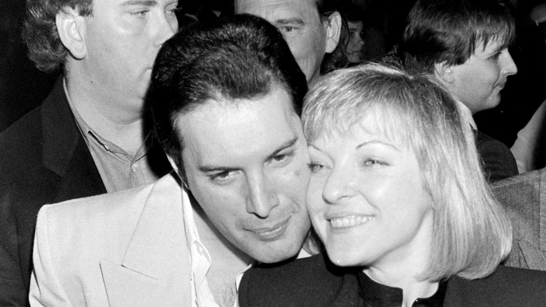 Freddie Mercury embracing Mary Austin