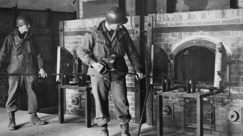 U.S. soldiers inspect crematorium ovens at Dachau