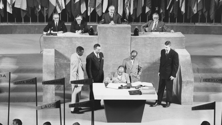 Liberian politician and diplomat Gabriel Lafayette Dennis signs U.N. charter at 1945 San Francisco conference