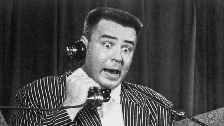 The Big Bopper holding telephone