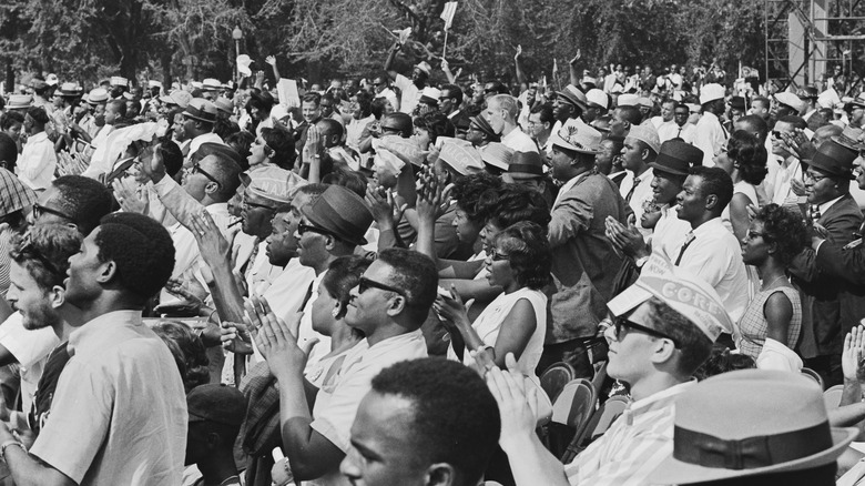 Marchers clapping together