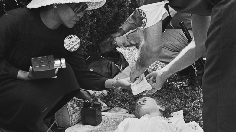 Woman and medic attending child