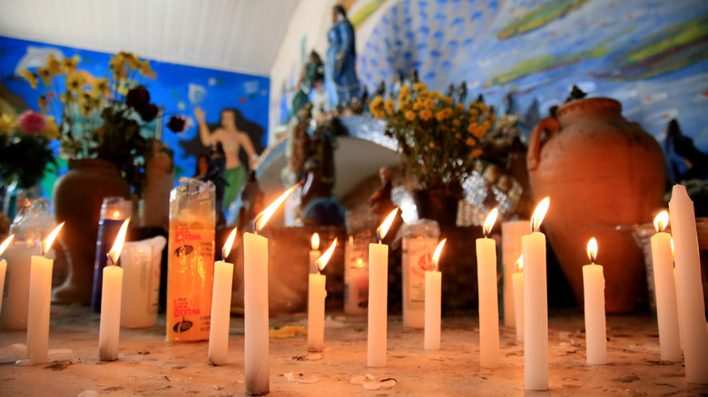 lit candles in the sanctuary of orixa Iemanja, 