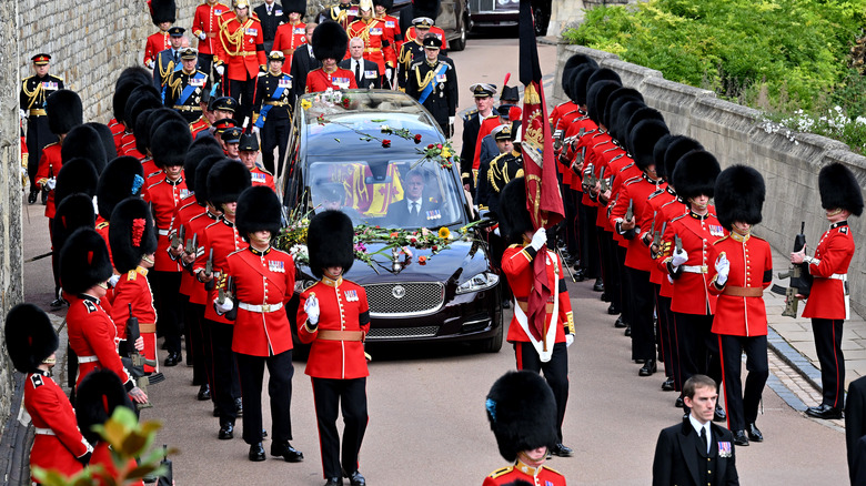 Guards lead queen's coffin