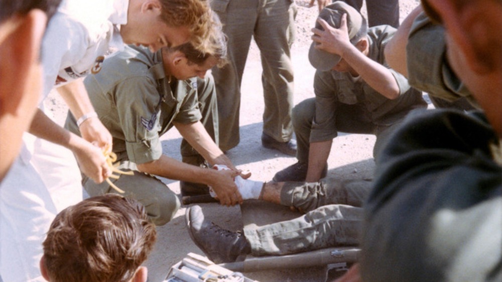 Medics treat an ARVN soldier blown up in a minefield 