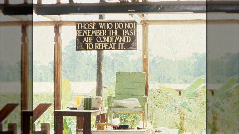 Jim Jones' "throne" in the pavilion under a sign