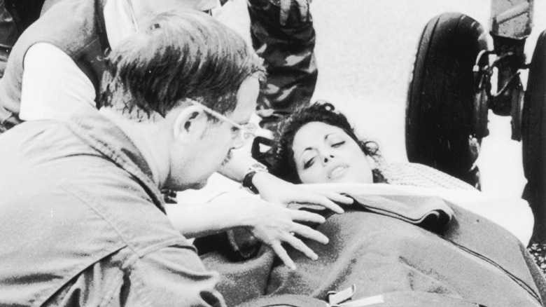 Jackie Spieir being transported by medics after being shot