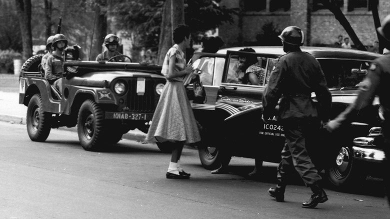 Little Rock Nine student with escort