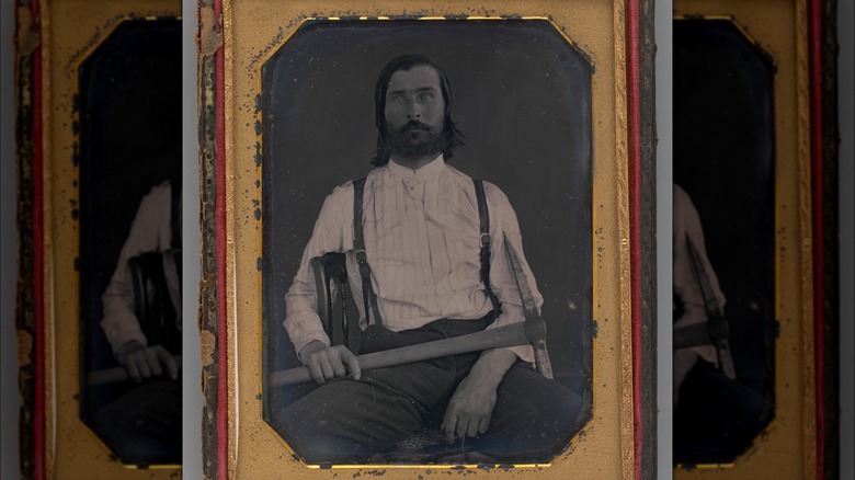 1851 man holding pickaxe