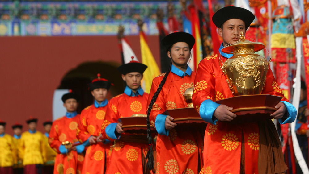 Performers dressed in the costumes of former eunuchs 