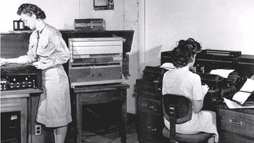 Cropped photo by military photographer of the Purple analog machine in use at SIS