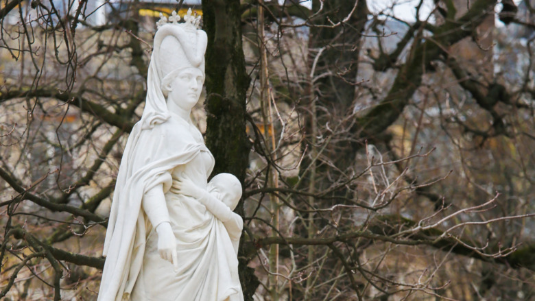 statue of Margaret of Anjou in front of barren trees