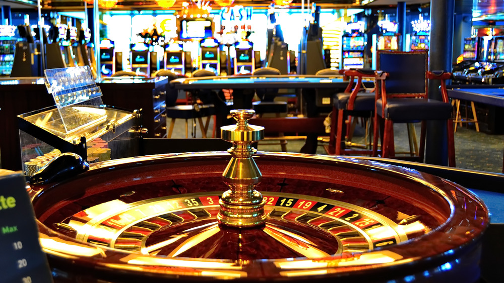 Modern casino interior with roulette wheel