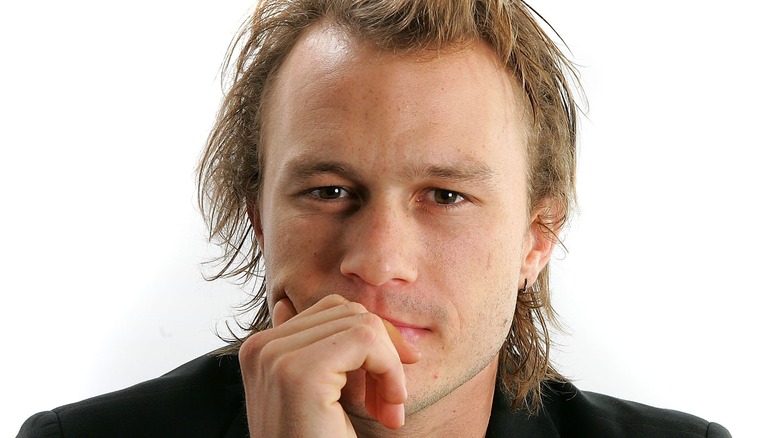 Heath Ledger hand on face