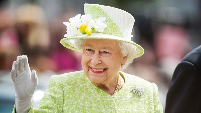 Queen Elizabeth II smiling waving