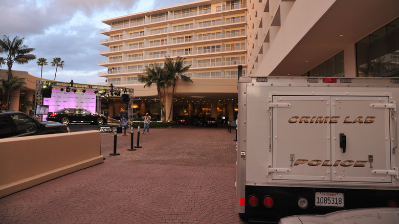 Crime lab truck in front of the Beverly Hilton Hotel