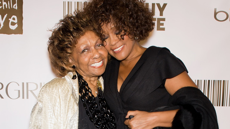 Whitney and Cissy Houston hugging at an event