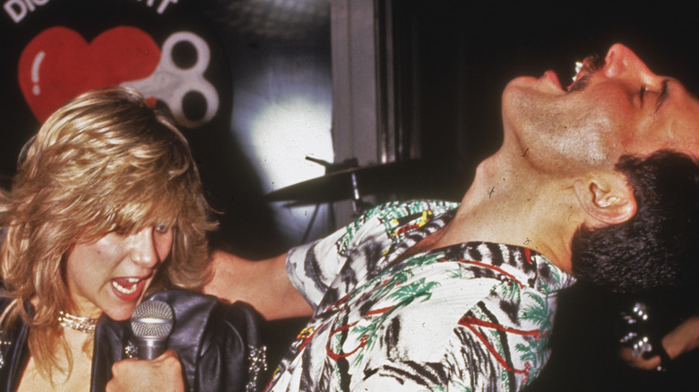 Freddie Mercury performing a duet with Debbie Hart
