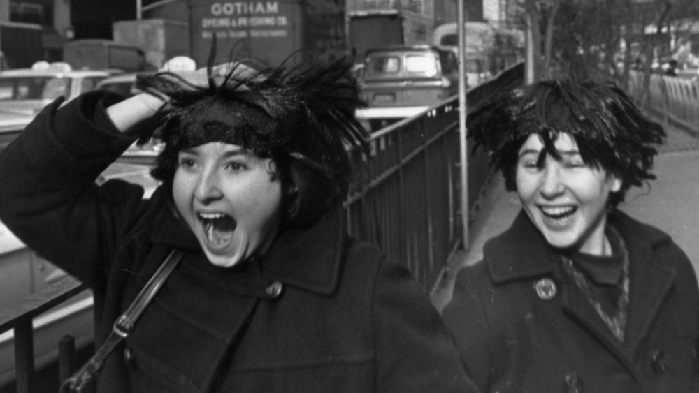 Two American fans in Beatle wigs