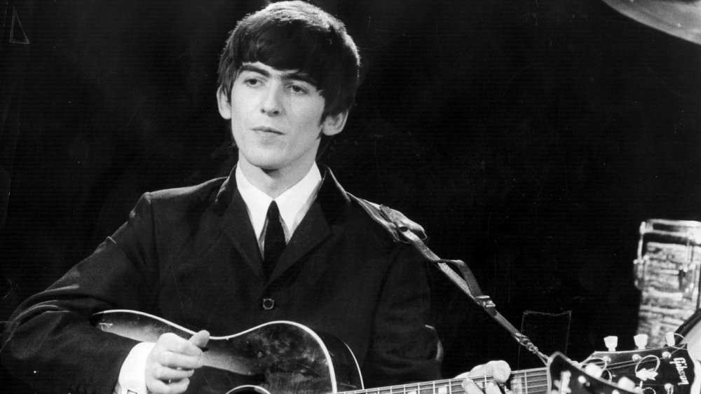 George Harrison onstage with the Beatles