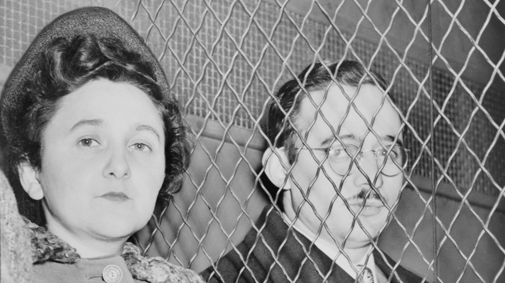 Julius and Ethel Rosenberg, separated by heavy wire screen