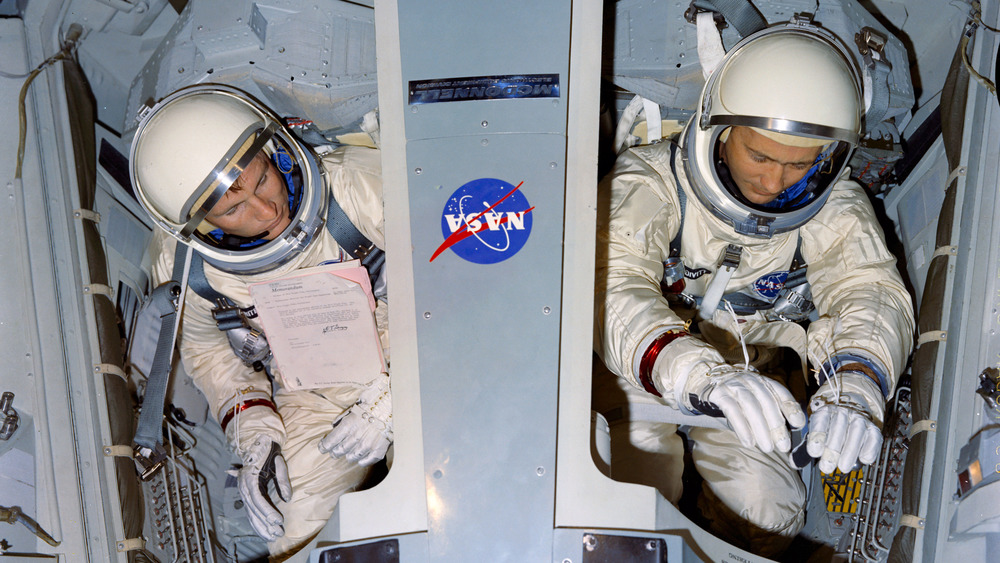 Edward H. White II and James A. McDivitt going through tests on a simulator