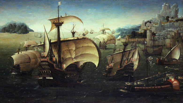 1540 painting of sailing ships off rocky coast