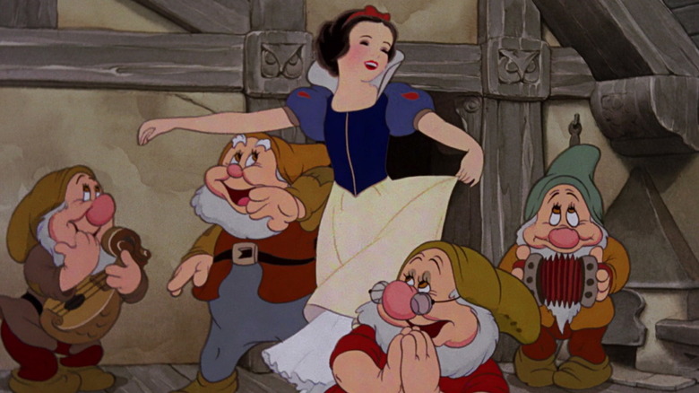  Snow White dancing with the Seven Dwarfs.