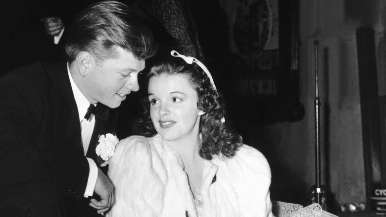 Judy Garland and Mickey Rooney looking at each other