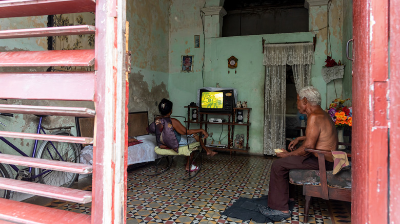 Poor family watching TV