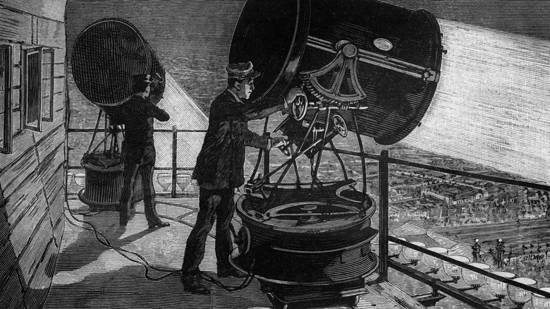 Installation of electric light projectors built by Sautter and Lemonnier on the terrace of the Eiffel Tower engraving from the book "Album of science famous scientist discoveries" in 189