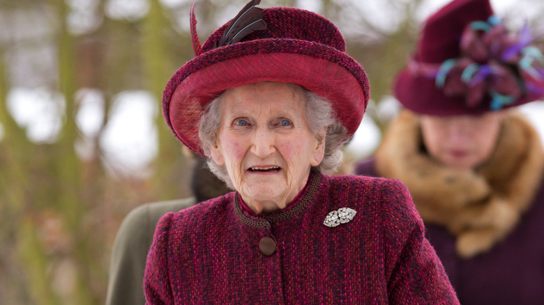 Margaret Rhodes maroon hat and coat