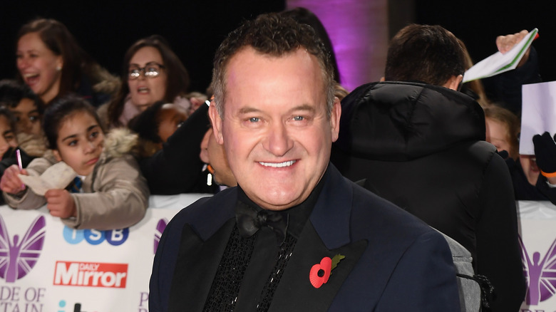 Paul Burrell black suit smiling