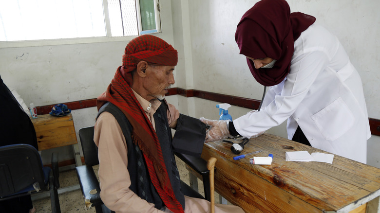 doctor with male patient in yemen