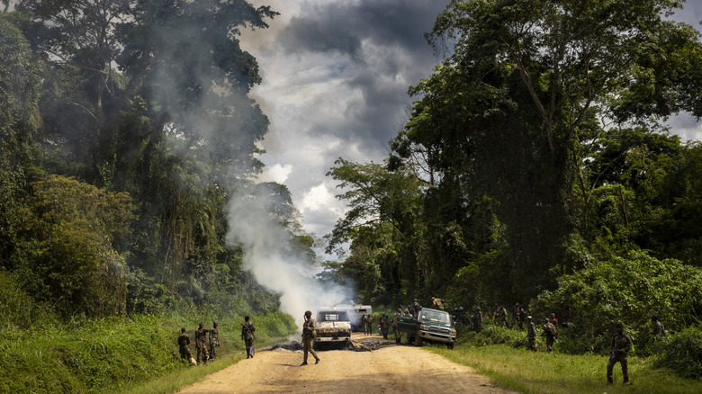 Congolese Army Soldiers and UN troops inspect an ambush site